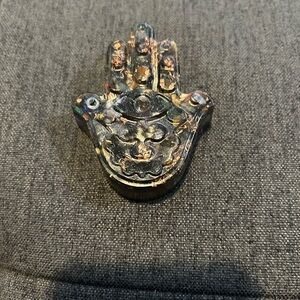 Set of 2 resin sculptures- a hamsa and a leaf for prosperity and clearing